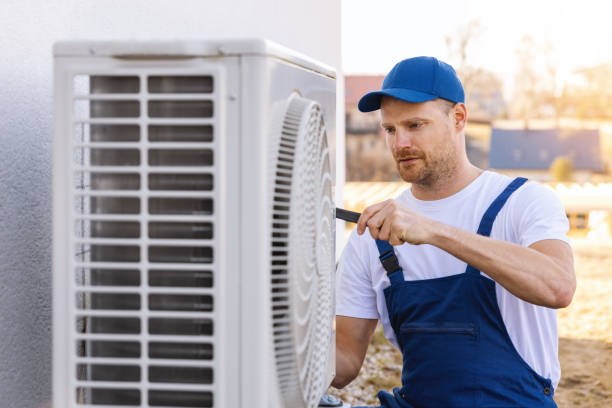 HVAC technician servicing an outdoor air conditioner in Rancho Santa Margarita